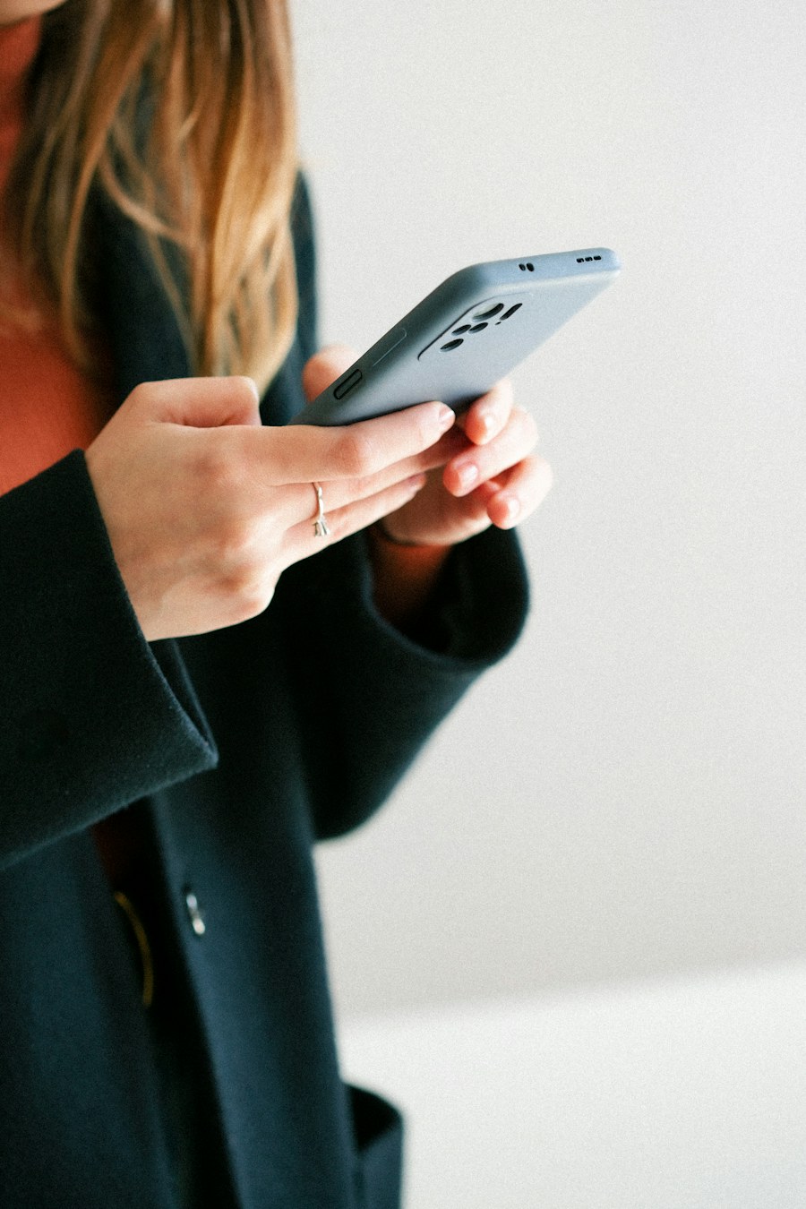 A woman scrolling on her phone